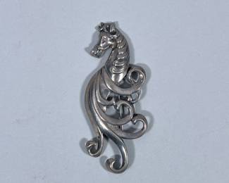 STERLING SILVER HORSE BROOCH | Designed as a Sterling silver horse/seashorse brooch/pin, marked on back “Sterling”; 17.9g - w. 1.5 x l. 3.5 in