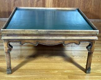 LEATHER TOP COFFEE TABLE | Green leather top with embossed gilt border and carved legs. - h. 19.25 x w. 34 x l. 34 in