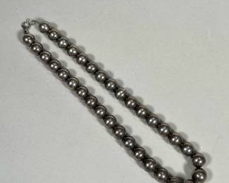 STERLING BEADED NECKLACE | Sterling silver beaded necklace on a silver chain, marked 925 on the clasp, beads tested to silver; 1.7 ozt - l. 15.75 in