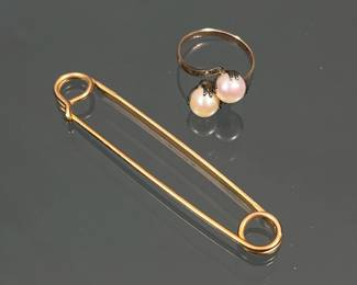 (2pc) 10k & OTHER GOLD JEWELRY | Including a 10k gold ring with two pearls, marked inside the band K10 and tested (2.38g); plus a large yellow gold tone safety pin, 12k gold filled, marked.