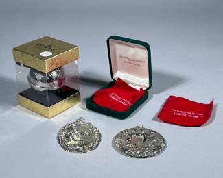 STERLING SILVER CHRISTMAS ORNAMENTS | Including: Reed & Barton sterling silver “Francis I Nativity” 2000 ornament (0.97 ozt.), Towle Sterling silver wreath ornament (0.85 ozt.), and Towle silver plate 2000 Special Edition Sleigh Bell ornament, Total weighable silver: 1.82 ozt. - dia. 2.5 in (sleigh bell)