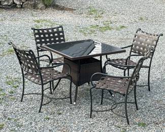 (5pc) PATIO SET | Outdoor dining suite comprising: 4 curved metal and woven armchairs with x-stretcher and woven square table with glass top. - h. 29 x w. 35 x l. 35 in