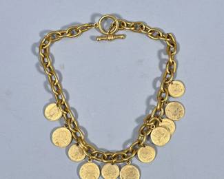 BRASS COIN NECKLACE | Mixed metal necklace with 11 alternating mixed metal antique-style coin pendants. - l. 19 in
