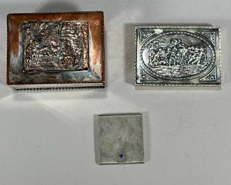 (3pc) 800 & Other Silver Cases | Including an 800 silver matchbook case with blue cabochon, an 800 silver cigarette or card case with repousse lid depicting putti and a ram, and an English Sheffield silver plated trinket box with repousse lid showing a genre scene; total 800 silver weight 4.09 ozt - h. 1.75 x w. 3.25 x l. 4.25 in (trinket box)