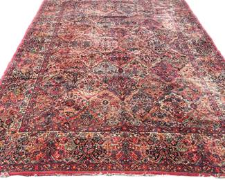 KARASTAN WOOL CARPET | Having an overall pattern on a red ground. - w. 12' 2" x l. 8' 8" ft