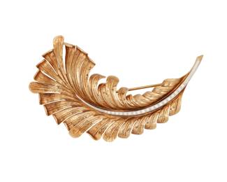 1001
Tiffany & Co.: A Gold and Diamond Feather Brooch
Of a textured design centering a row of single-cut diamonds weighing approximately 0.60 carat, signed Tiffany

Measures: 3 1/2 x 1 1/2 in.
24.0 grams gross
Estimate: $400 - $600