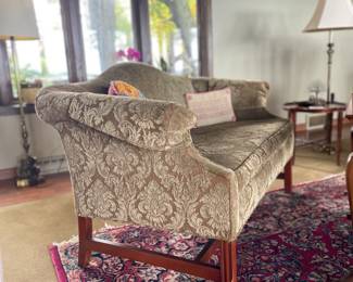 Elegant settee featuring graceful curves is ready for its next round of life—perfect for those looking to restore it to its former glory and add a touch of sophistication to any room.