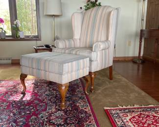 Queen Anne wingback chair and matching hassock in solid cherry wood. The classic, curved legs are in pristine condition, showcasing the quality craftsmanship.