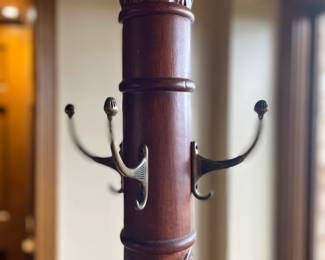 Solid, carved hardwood coat, hat, and umbrella stand with a stunning presence. A true statement piece that combines functionality with timeless elegance.