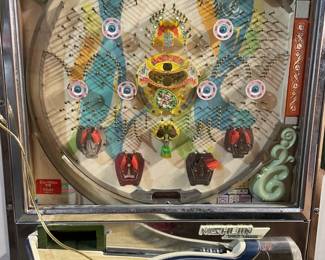 Original Pachinko Machine! Pristine Condition! With a cult classic following, mid-20th century Pachinko machines have become prized collector's items, celebrated for their craftsmanship, nostalgic charm, and decorative appeal. Beyond Japan, enthusiasts collect these unique vintage pieces as captivating displays for their homes. Pachinko machines blend entertainment, nostalgia, and cultural intrigue, making them fascinating collectibles and conversation pieces that bring a touch of Japanese gaming history into any space.