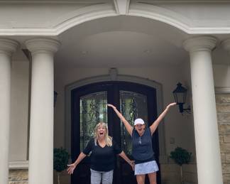 Erryn and Bonnie in front of the beautiful home