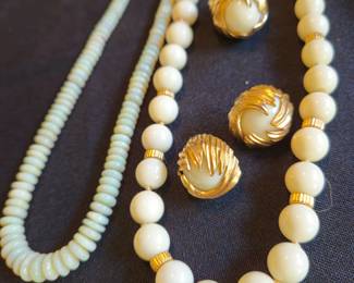 Opal beads at left, 14 k and white necklace, earrings, and ring.