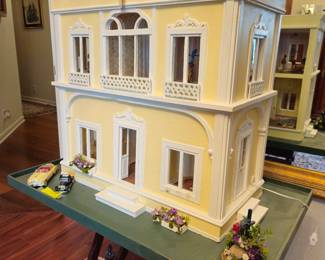 Architectural model doll house on revolving base. Acrylic back panel to protect the furnishings.