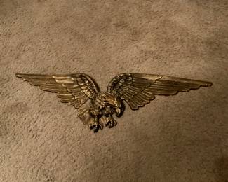 Over 3 ft. Heavy Brass. Has screw holes for wall hanging.