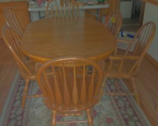 Large dining table with 6 chairs. 4 have arms.