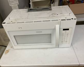 Large Frigidaire Microwave with hardware to place under kitchen cabinet.