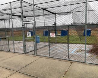 Batting cage with 4 machines and a ball lift. 2 for softball and 2 for baseball