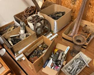 Collections of various iron items: shoe maker tools, horseshoes,  railroad spikes, etc.
