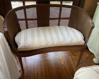 Vintage caned loveseat.