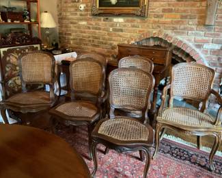 Vintage set of six caned French chairs.