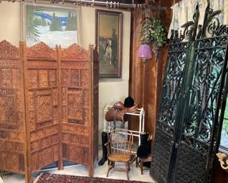 Vintage Hand Carved Teak Wood Hinged Four-Panel Folding Screen. Vintage Heavy Wrought Iron Hinged Folding Gates. Hermes Leather Dressage Saddle.