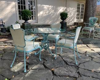 Vintage mid-century Russell Woodard wrought iron table with four chair.