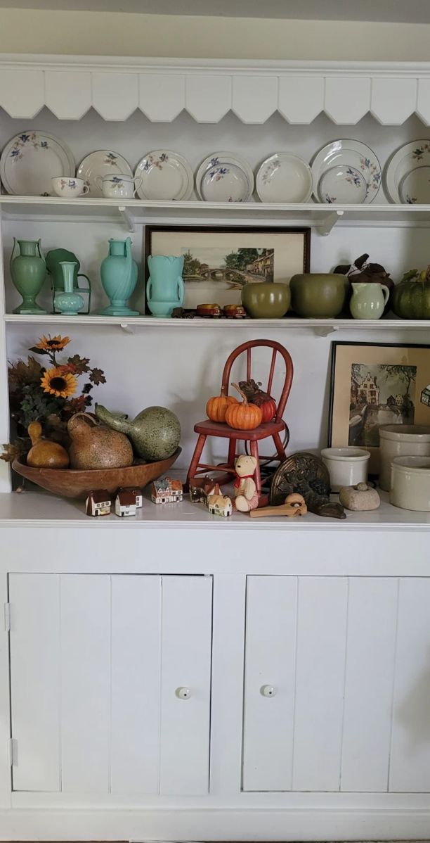 Antique primitive cabinet with Bluebird China on It pottery and some art