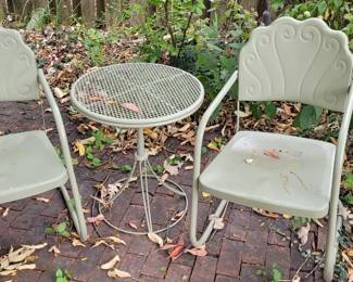 Very sweet and comfortable metal patio chairs and that table is adjustable mid-century modern