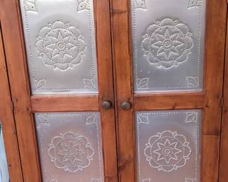 This is an antique pie safe she redid the tin herself about 35 years ago