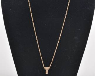 Gold necklace with letter T pendant