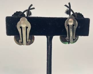 Reverse view of Austria "forbidden fruit" glass pear and metal enameled leaf clip earrings