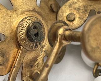 Closeup of back of vintage pair of milk glass beaded dangles earrings, screw back; Western Germany