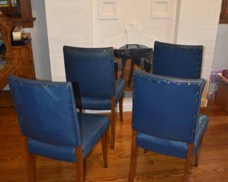 Custom Art Deco chairs by Long & Wexlear, a renowned Australian furniture manufacturer. Wood frames with blue leather custom upholstery, pyramid-shaped brass studs 