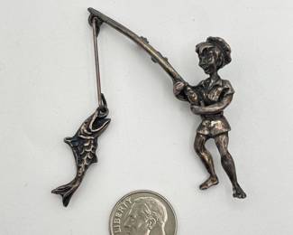 Whimsical vintage silver fisherman brooch, joyous young man landing a fish