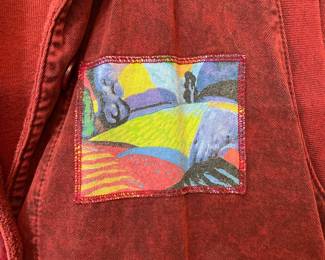 Closeup of Michael Leu two-piece long sleeve dress with button front pocketed loose vest