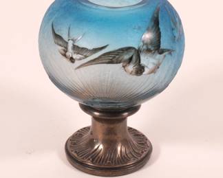 Daum Nancy circa 1890s beautifully crafted enameled carved glass open globe on footed metal pedestal, depicting swallows in flight at sunrise against a graduated blue sky. Signed Daum Nancy and with the cross of Lorraine.