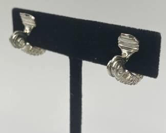 Backs of Monet pair of silver tone rhinestone half hoop clip earrings