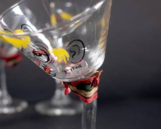 Closeup of vintage Mid Century Modern set of 4 hand painted "tipsy" or "Beau Brummel" martini glasses by Gay Fad Studios (Fran Taylor)