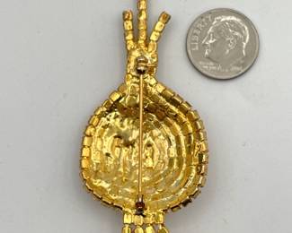 Reverse view of vintage "Bermuda onion" pin sparkling with Austrian crystals in clear, citrine, yellow, and green