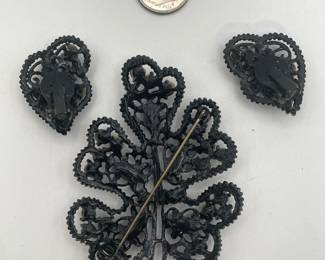 Reverse view of blue, green, and pink rhinestone brooch and earrings, bright rhinestones, Japanned black setting