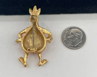 Reverse view of delightful anthropomorphic smiling onion brooch, hands on hips; enameled and gold tone metal
