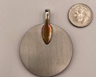 Reverse view of scenic pendant, fired resinated glass on stainless, argentium silver plate bale