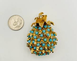 Pineapple brooch in gold-tone metal with turquoise color beads.