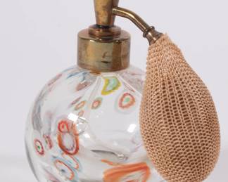 Closeup of a lovely vintage millefiori art glass perfume bottle with atomizer