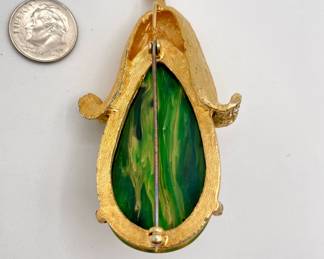 Reverse side of 1930s-1940s squash form brooch, Bakelite and gold tone metal with small rhinestones