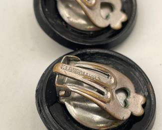 Reverse view of black circular faceted clip on earrings, made in West Germany