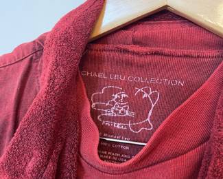 Closeup of Michael Leu two-piece long sleeve dress with button front pocketed loose vest