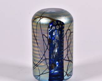 Beautiful art glass paperweight, iridescent exterior with cut to clear panel showing interior millefiori blossoms; signed by artist, 1979