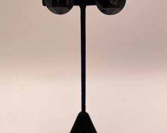 Black circular faceted clip on earrings, made in West Germany