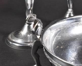Closeup of rare vintage Farberware Art Deco weeping female nude chrome taper candle holders and matching round low bowl with incised band 
